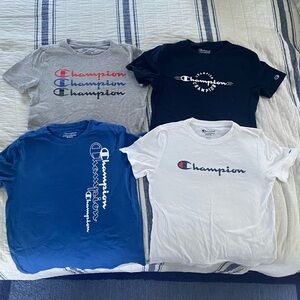 Set of four boys champion shirts - all different colors - size medium (10-12)